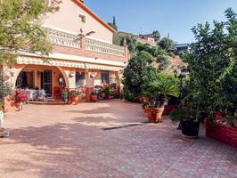 CASA EN VENTA CON OCHO HABITACIONES Y PARCELA DE 926 M2 CON HUERTO, PISCINA Y AMPLIAS TERRAZAS A DIEZ MINUTOS DE LAS PLAYAS DE CUNIT photo 0