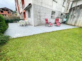 Piso en planta baja con jardín privado y terraza en Arredondo – Urbanización con piscina y garaje incluido photo 0