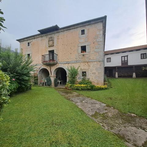 CASA DE PIEDRA CON TERRENO URBANO EN RIVA DE RUESGA photo 0