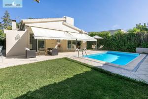 CHALET CON PARCELA Y PISCINA EN URBANIZACIÓN LOS CHOPOS. photo 0