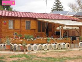 FINCA DE 5.615 Mº VALLADA CON UNA ACOGEDORA CASA DE MADERA CON ALMACÉN DE 86 Mº photo 0