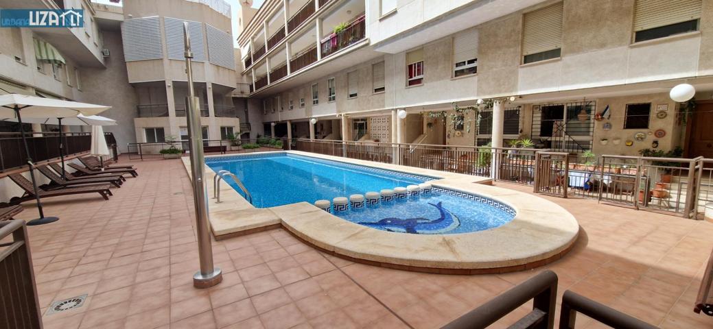 Amplio triplex con piscina comunitaria y garaje en exclusiva photo 0