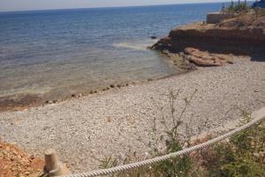 PARCELA EN PRIMERA LINEA DE LA PLAYA DE LAS ROTAS - DENIA CON LICENCIA DE CONSTRUCCIÓN VIVIENDA photo 0