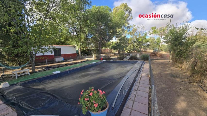 PARCELA CON VIVIENDA Y PISCINA A LA VENTA photo 0