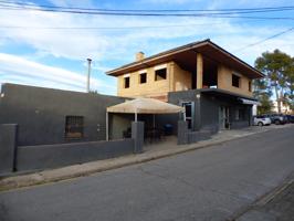 CASA EN CONSTRUCCIÓN CON LOCAL COMERCIAL ALQUILADO EN FUNCIONAMIENTO EN CASTELLNOU DE BAGES photo 0