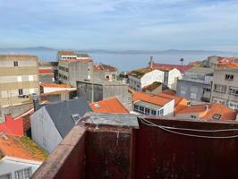 Edificio con garaje y local comercial en el centro de Ribeira photo 0