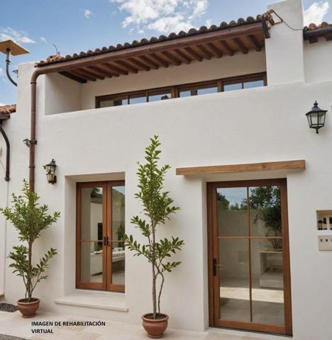 Casa con patio para rehabilitar en Godall photo 0