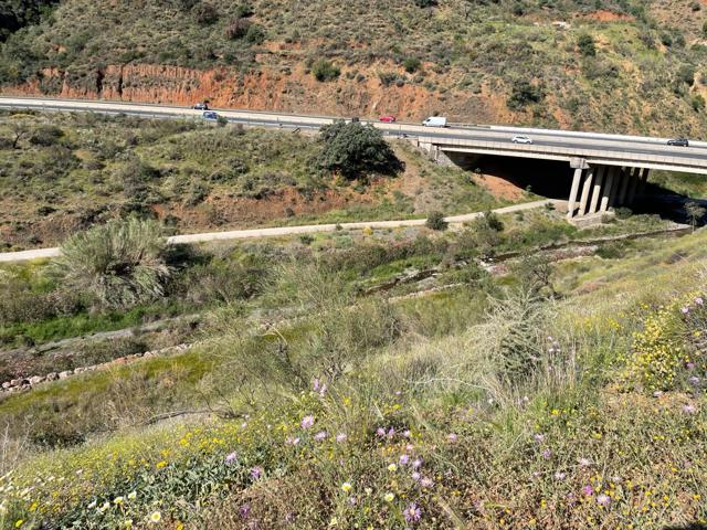 Se vende parcela rústica en los Montes de Málaga, junto a la carretera photo 0