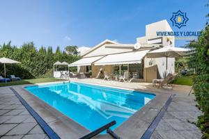 CHALET CON PARCELA Y PISCINA EN URBANIZACIÓN LOS CHOPOS. photo 0