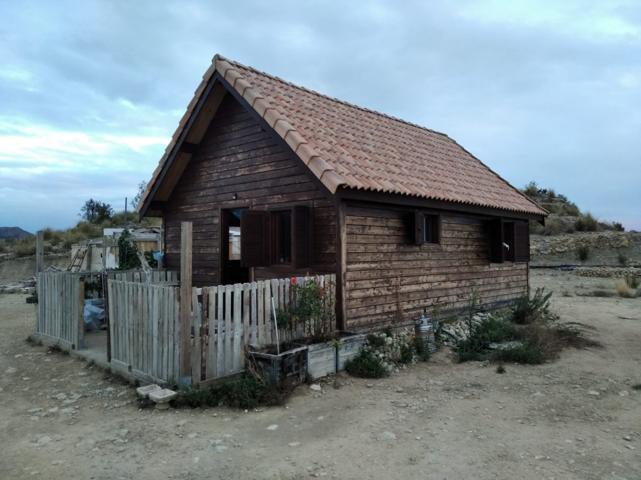 TERRENO CON CASA DE MADERA EN XIXONA photo 0