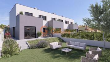 Adosada en venta en Cunit, Park central photo 0