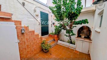 Adosada en venta en Es Castell photo 0
