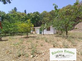 Casa con terreno en venta en Jubrique photo 0