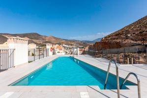Obra nueva junto al mar. Piso de 2 dormitorios con piscina en azotea en Castell de Ferro photo 0