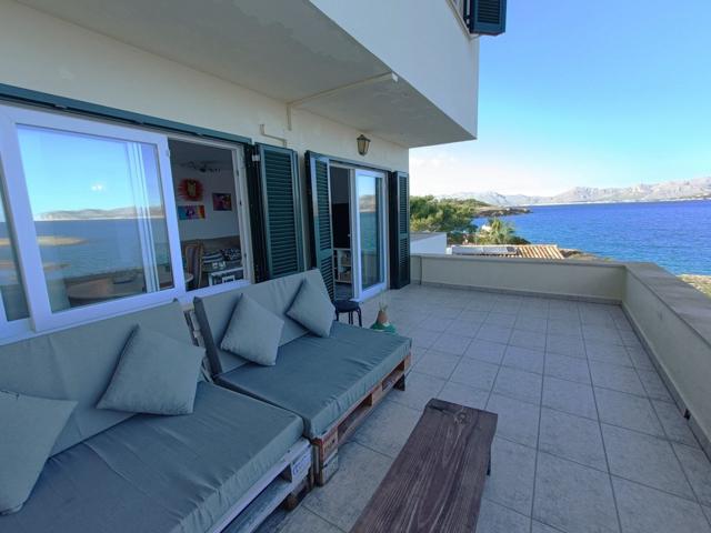 CHALET ADOSADO EXCLUSIVO EN PRIMERA LÍNEA DE MAR EN ALCUDIA MALLORCA photo 0