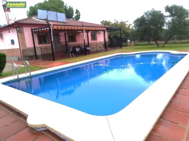 Se vende parcela con casa y piscina photo 0