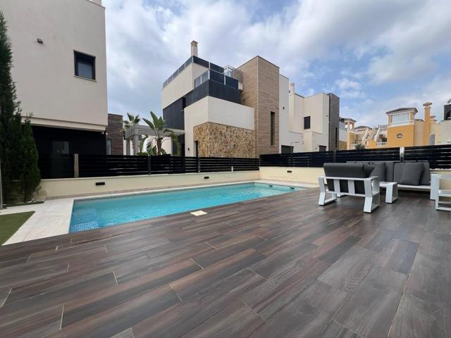 VILLA DE LUJO EN LOMAS DE CABO ROIG CON PISCINA PRIVADA Y PARCELA DE 200 M2. 3 DORM. 3 BAÑOS. photo 0