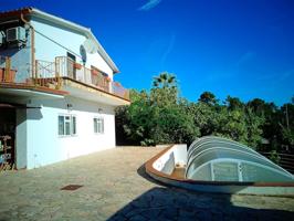ENCANTADORA CASA CON DOS VIVIENDAS INDEPENDIENTES, PISCINA CUBIERTA Y VISTAS A LA MONTAÑA – LLORET BLAU photo 0