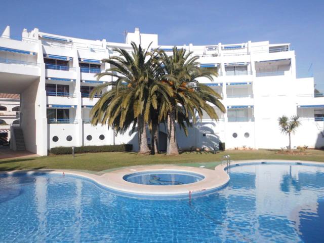 Apartamento dúplex cerca de la playa Romana con jardín y piscina comunitaria. photo 0