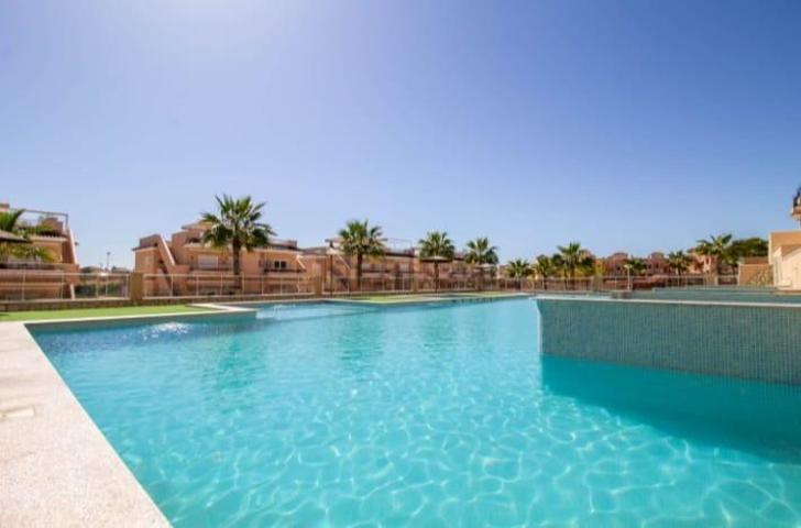 APARTAMENTO EN PLANTA BAJA CON PISCINA COMUNITARIA - ZONA URB. VISTA AZUL, PUNTA PRIMA - photo 0