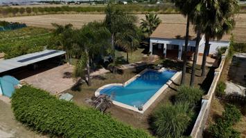 PARCELA RÚSTICA CON VIVIENDA Y PISCINA photo 0