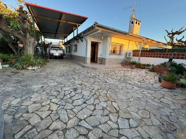 CASA TODA EN PLANTA CON JARDÍN photo 0