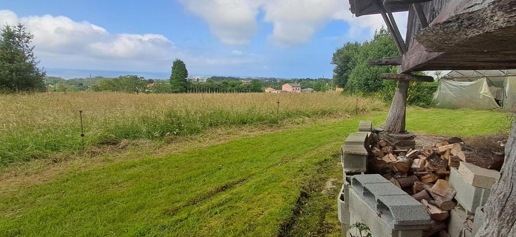 Casa de piedra y dos parcelas edificables con vistas al mar. photo 0