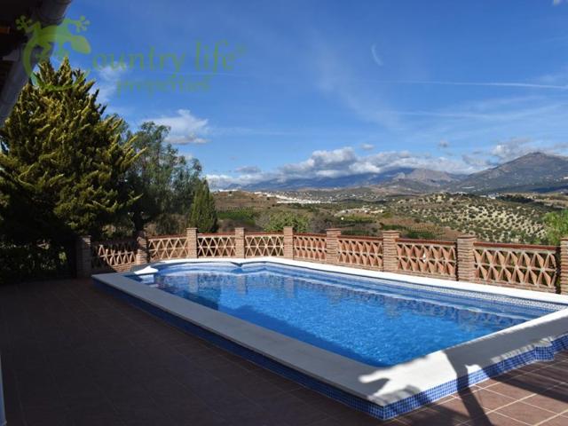 Villa En venta en Viñuela photo 0