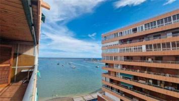 Piso en Venta en El Acequión, Torrevieja! Primera Línea con Acceso Directo a la Playa y Vistas Impre photo 0