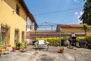 CASA PAREADA CON GARAJE Y TERRENO photo 0