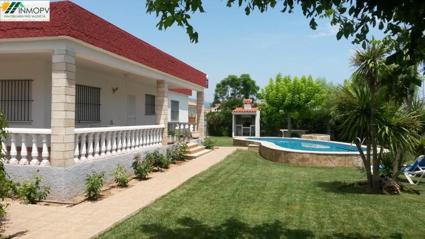 GRAN CHALET CONSTRUIDO EN UNA SOLA PLANTA CON AMPLIO JARDÍN Y PISCINA. ZONA BARBIGUERA. photo 0