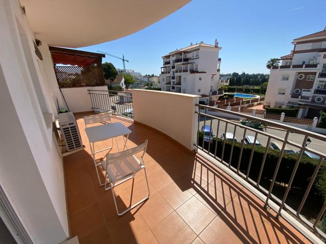 Fantástico apartamento en Mijas Costa con amplia terraza, piscina, trastero y garaje photo 0