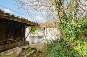 CASA RÚSTICA PARA REFORMAR CON HORREO Y FINCA EN TINEO photo 0