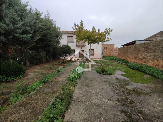 CASA CON TERRENO photo 0