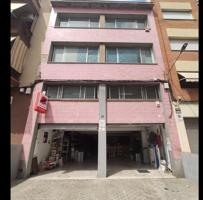 ¡Oportunidad de inversión: Dos edificios conectados con salida a dos calles en La Cirera! photo 0