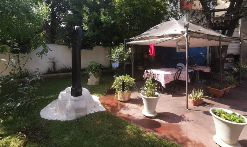 CASA A 4 VIENTOS ESTILO RUSTICO CON JARDÍN EN VENTA photo 0