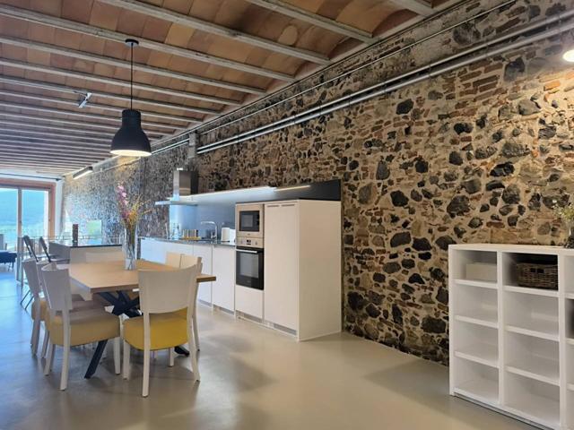 Casa de pueblo en venta en Hostalric, reformada con un estilo rústico y vanguardista photo 0