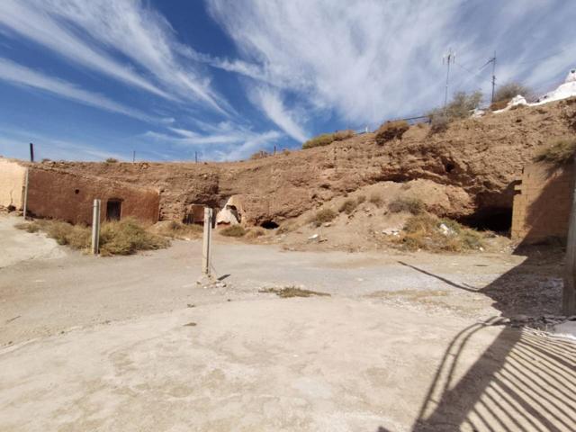 VENTA DE DOS CUEVAS CON PLACETA EN ALCUDIA DE GUADIX photo 0