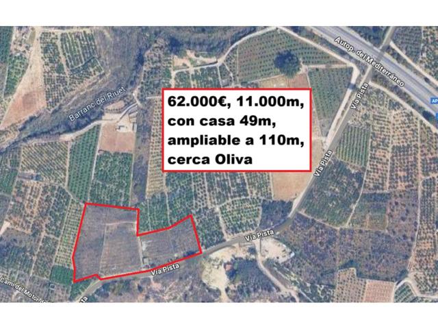 Terreno rústico de 11.000 m² con almacén convertible en vivienda – Oliva (Camino Les Mines) photo 0