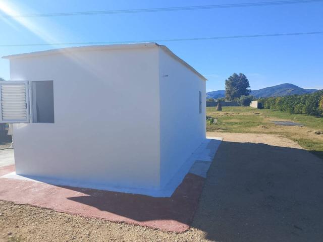 Terreno de 2100m con casa escriturada de 20m en Oliva photo 0