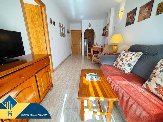 Piso de un dormitorio con piscina y garaje photo 0